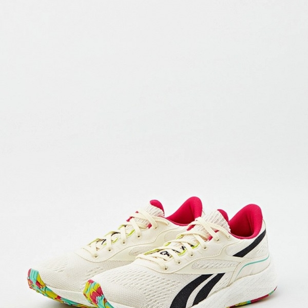 Reebok Cream and Black Athletic Shoes with Modern Design